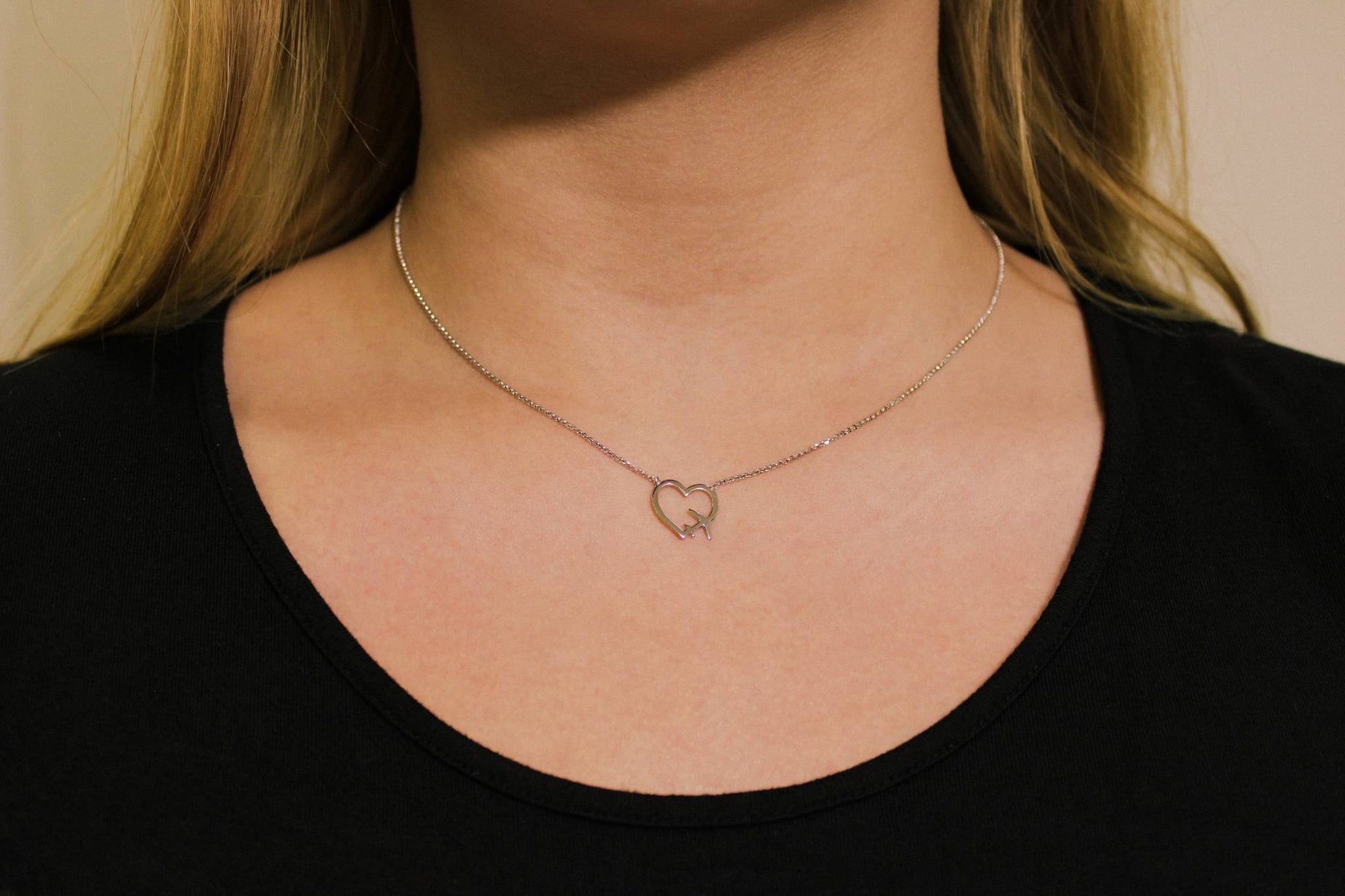 Kette mit Flugzeug und Herz