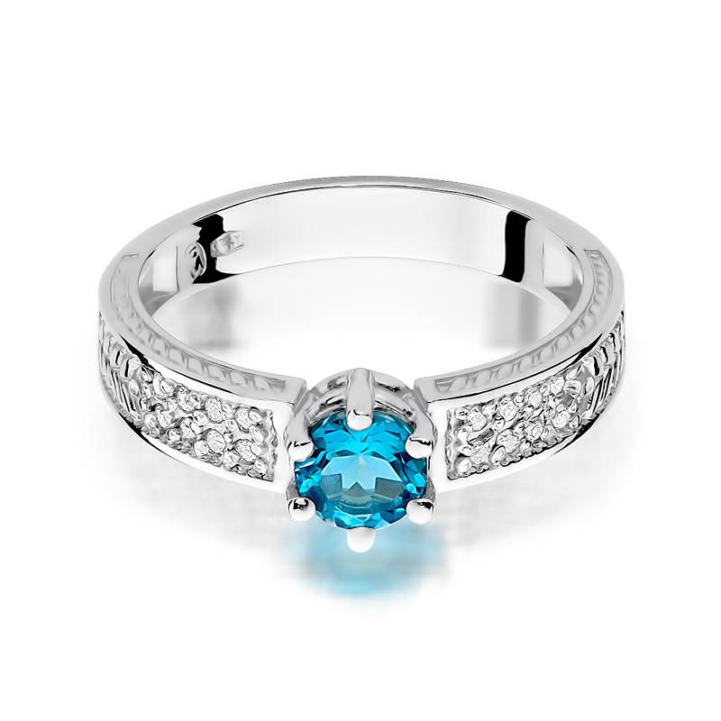 Anello In Oro con Topazio 0,50 ct e 16 Diamanti 0,08 ct