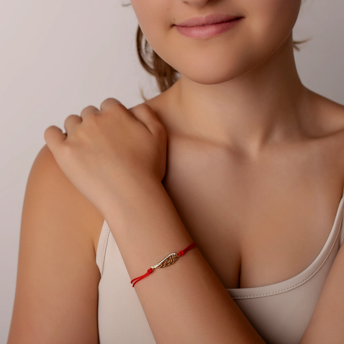 Pulsera de plata con cordón, ala con strass grande dorado