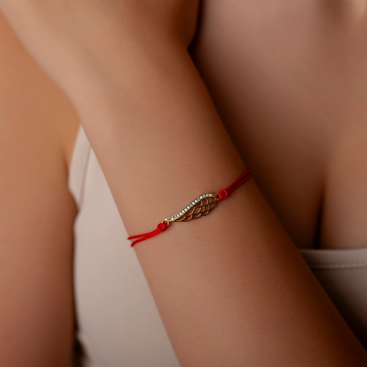 Pulsera de plata con cordón, ala con strass grande dorado