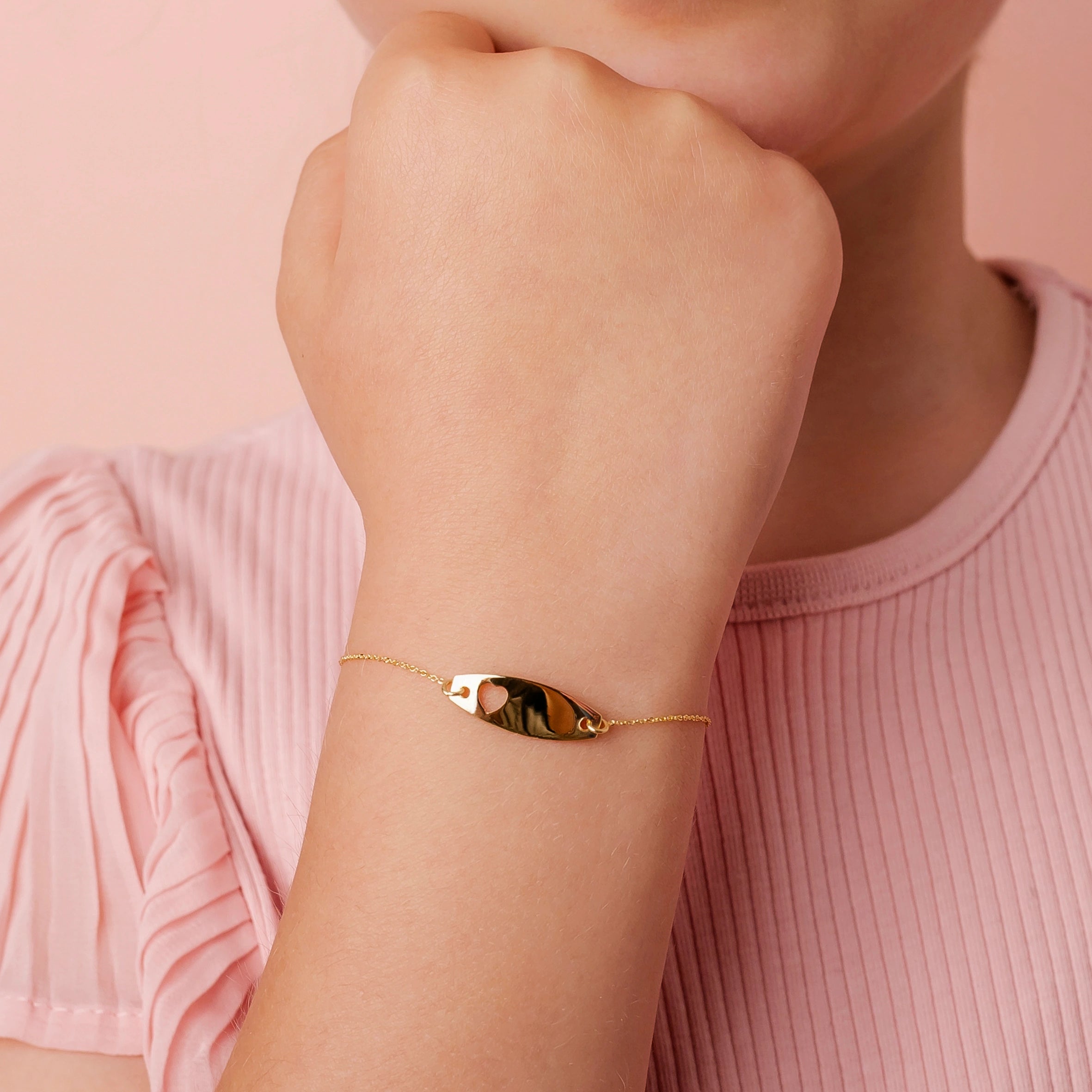 Gold Bracelet with Elliptical Plate and Heart