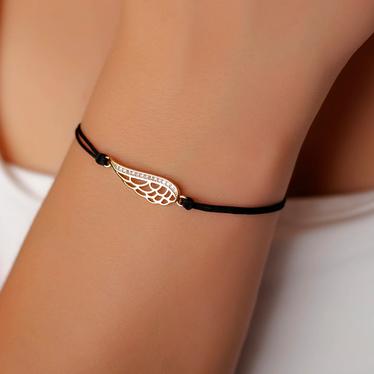 Bracelet en argent avec cordon en forme d'aile et gros strass
