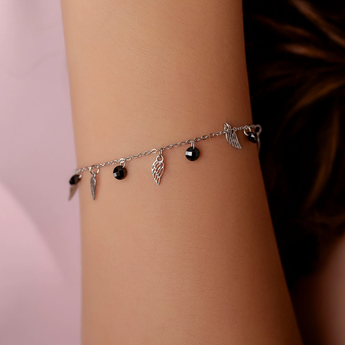 Rhodium Silver Bracelet with Wings and Black Beads