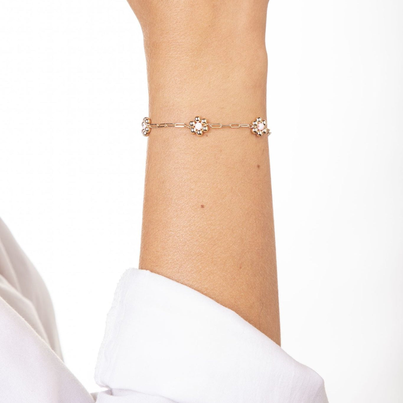 Rechteckiges Armband Goldfarben mit drei rosa Blumen