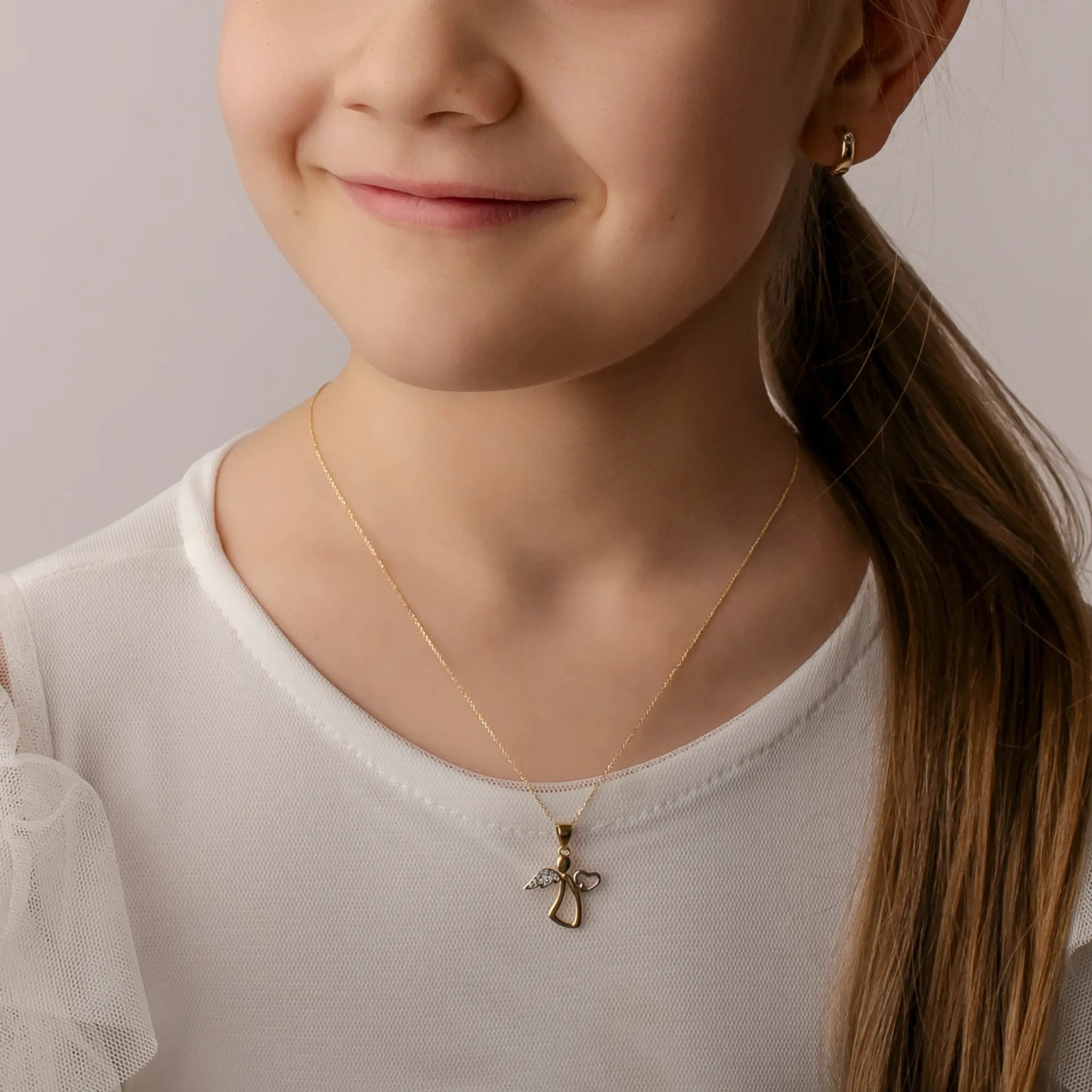 Collana in Oro con Angioletto Abbraccia Cuore