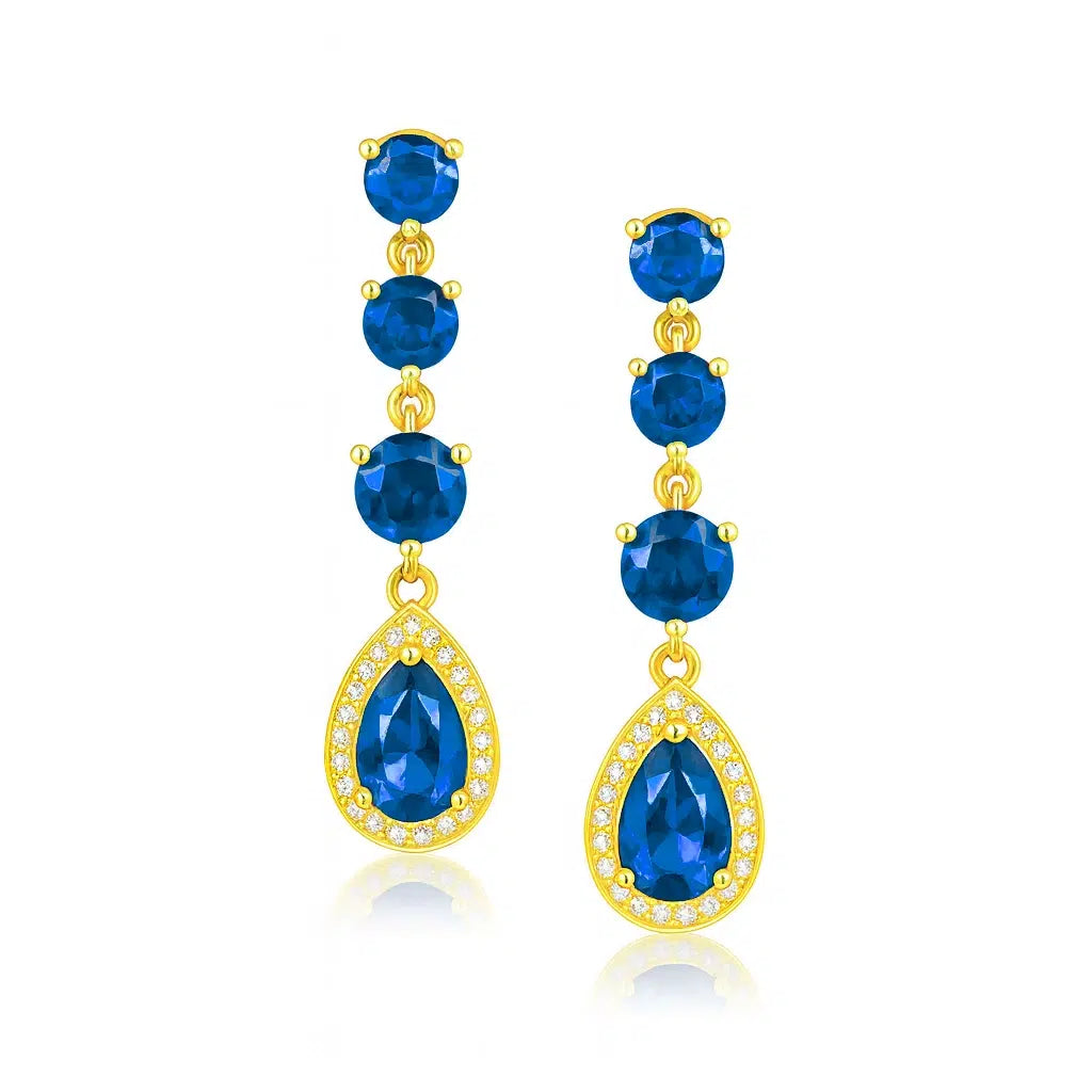 Goldene Tau-Ohrstecker mit blauen Zirkonen