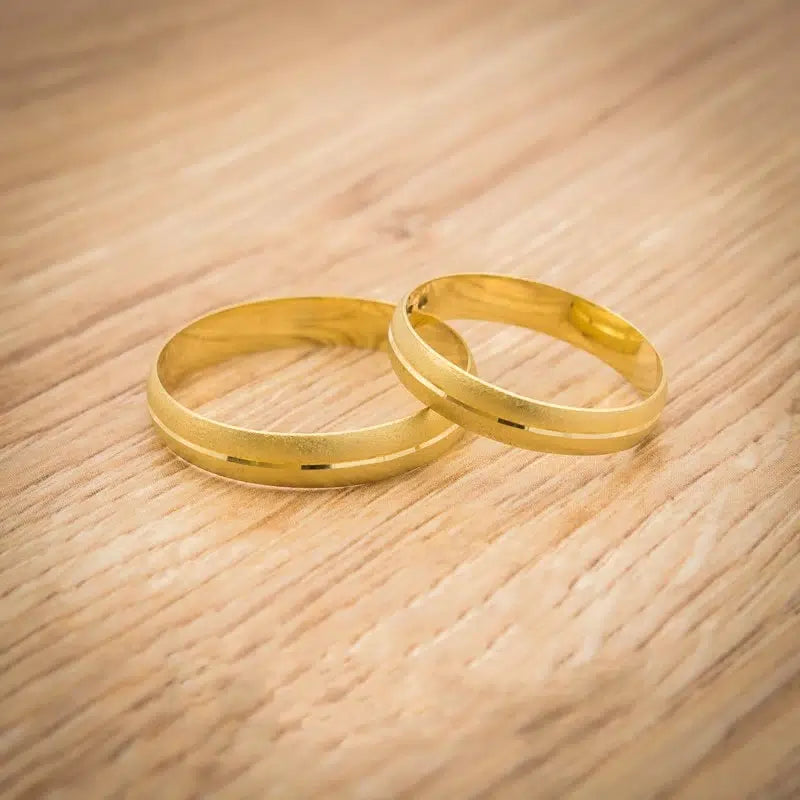 Alianzas de boda de oro amarillo con superficie arenada