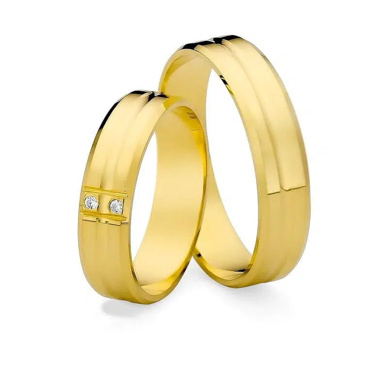 Flache Eheringe aus Gelbgold mit Zirkon