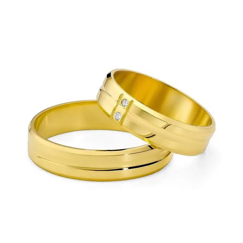 Flache Eheringe aus Gelbgold mit Zirkon