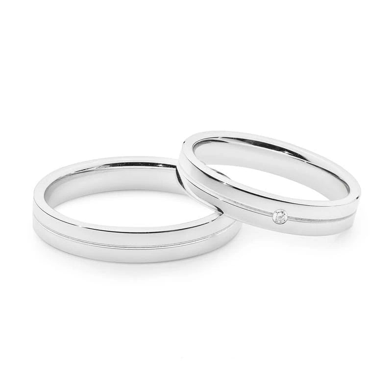 Eheringe aus Weißgold, flach mit Rille und Zirkon