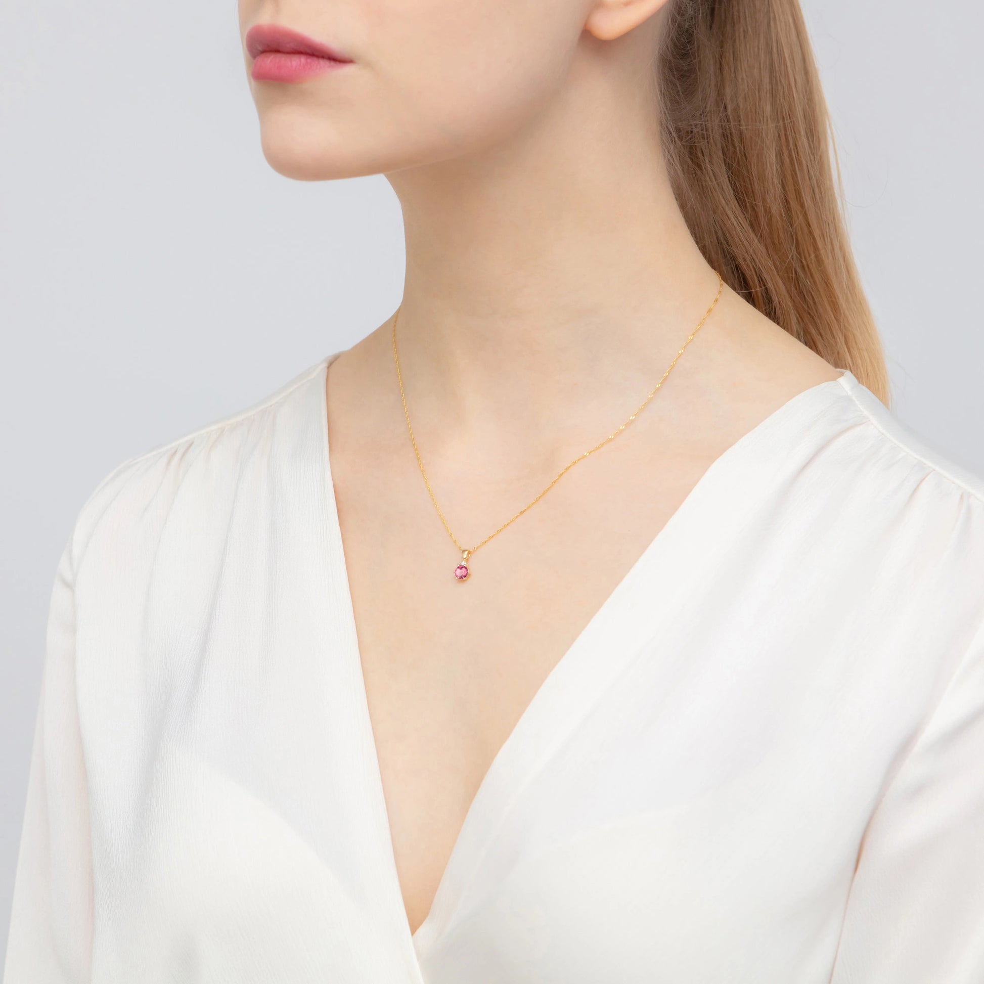 Aurora-Anhänger aus Gold mit rosafarbenem Topas und Diamant